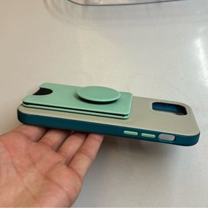 Otterbox iPhone 12 or 12 Pro case with PopSocket PopWallet attached.